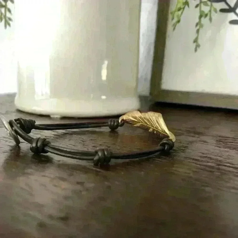 Chloe + Isabel black adjustable cord antique gold plated feather bracelet